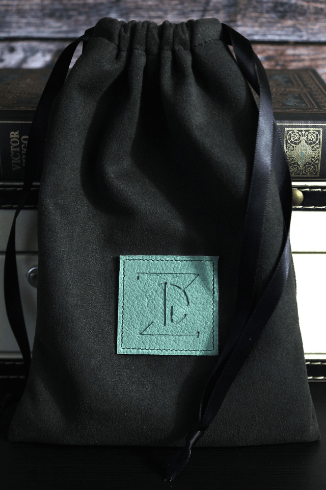 Portefeuille cuir bi-matière veau imprimé noir et chèvre vert amande
